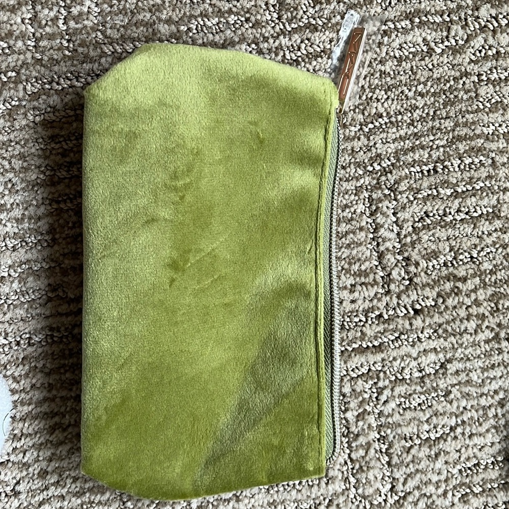 It’s a lime green handbag that is about the size of an iPhone 13 Pro Max